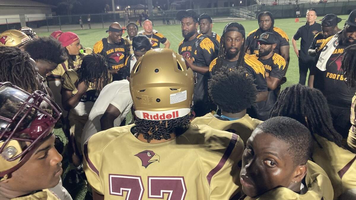 Miami Springs football coach T.Y. Hilton talks to his players after the Golden Hawks beat Miami Edison 49-0 on Friday at Ives Estates Park. Miami Springs football coach T.Y. Hilton talks to his players after the Golden Hawks beat Miami Edison 49-0 on Friday at Ives Estates Park.